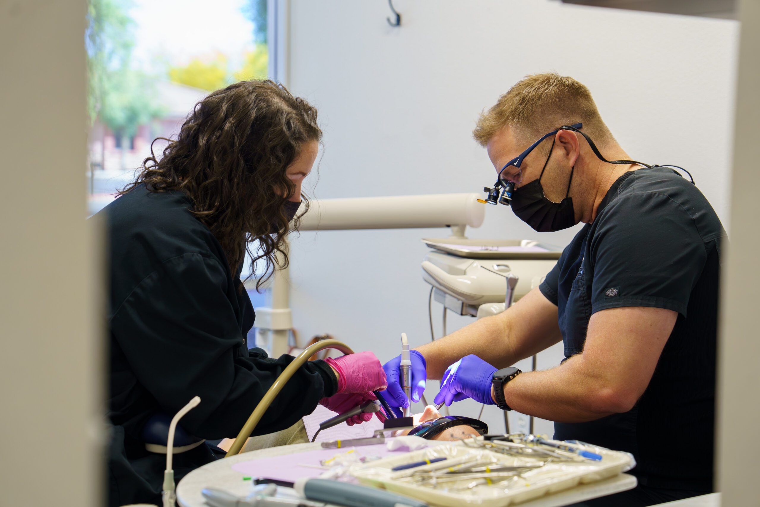 A dentist performing a dental procedure